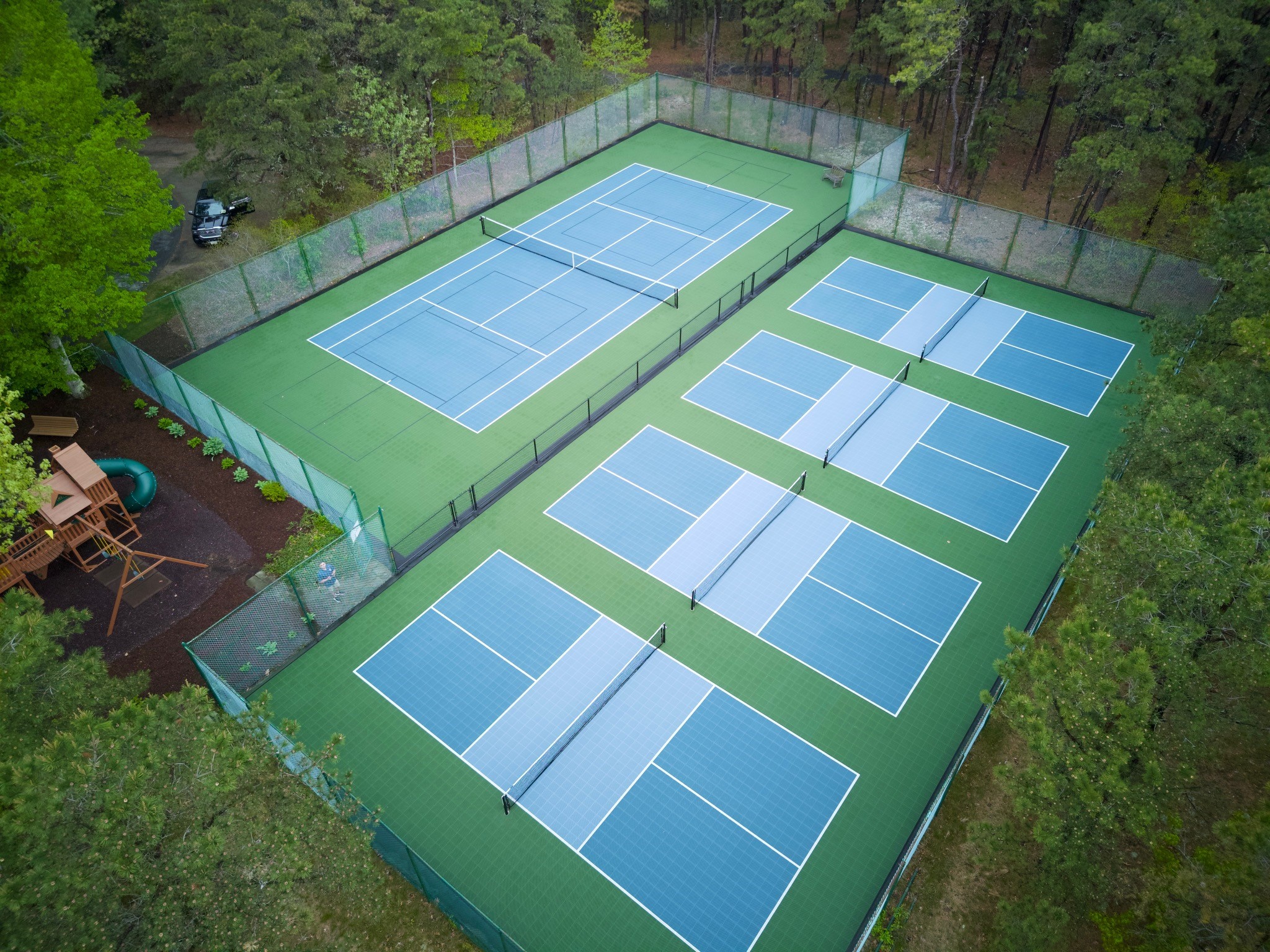 Photo of multiple courts build by Sport Court of MA, in Cotuit, MA.